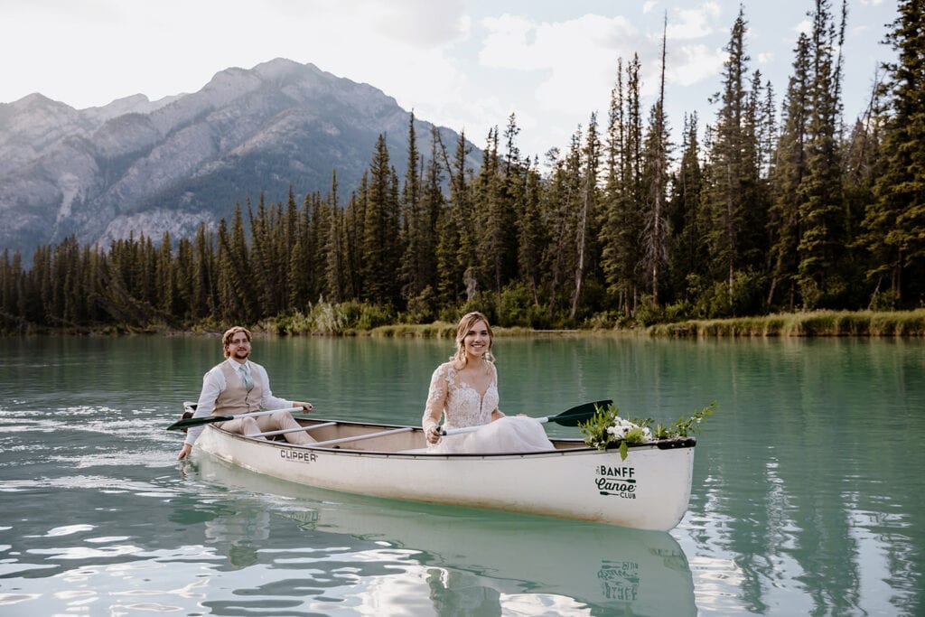 Bride and groom on a canoe ride in Banff National Park on their wedding day.