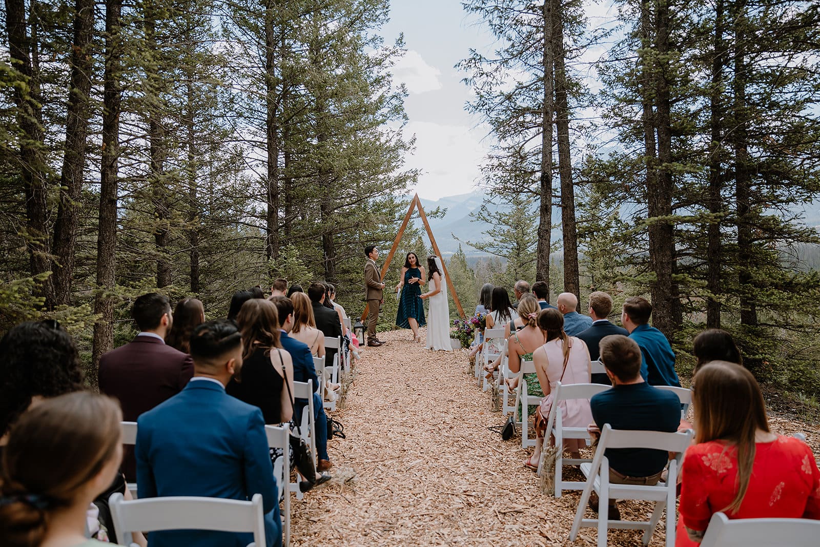 OUTDOOR WEDDING CEREMONY AT ALPINE CLUB OF CANADA IN CANMORE, AB