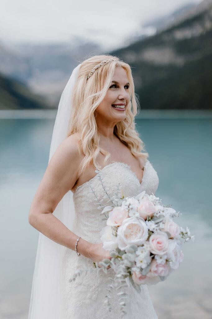 Bride with beautiful mountain scenery on her Banff helicopter wedding