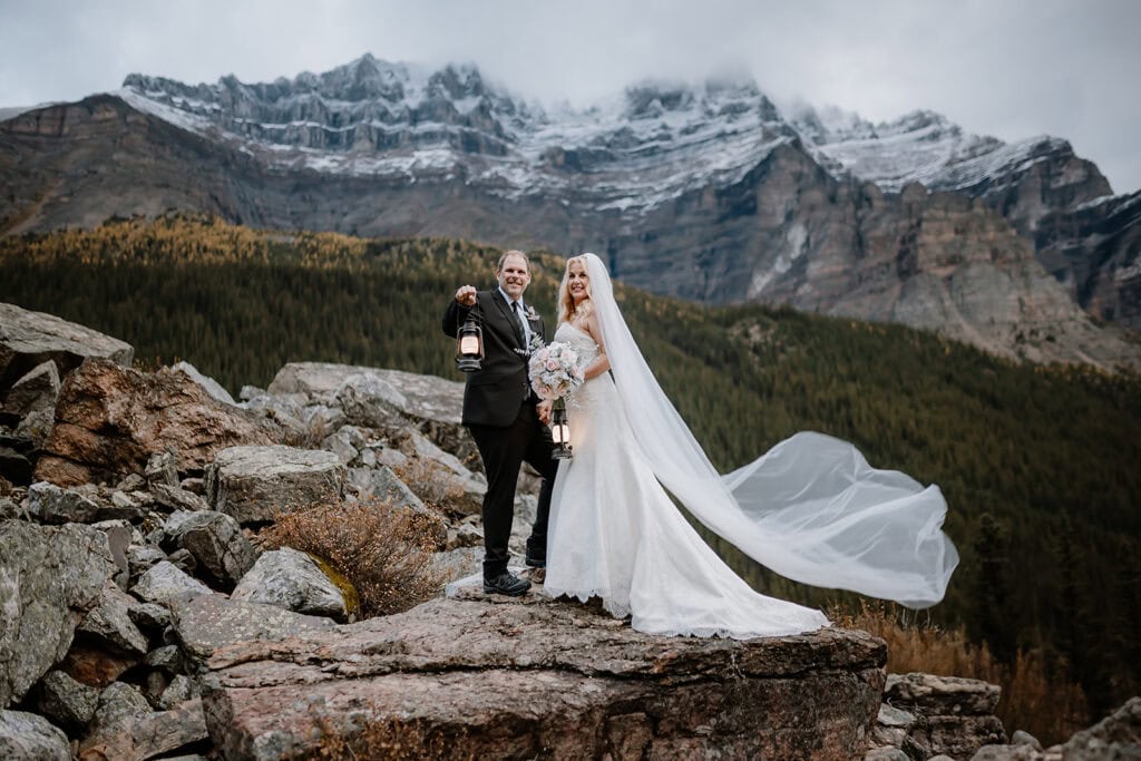 Couple with lanterns on their Banff Wedding Elopement 