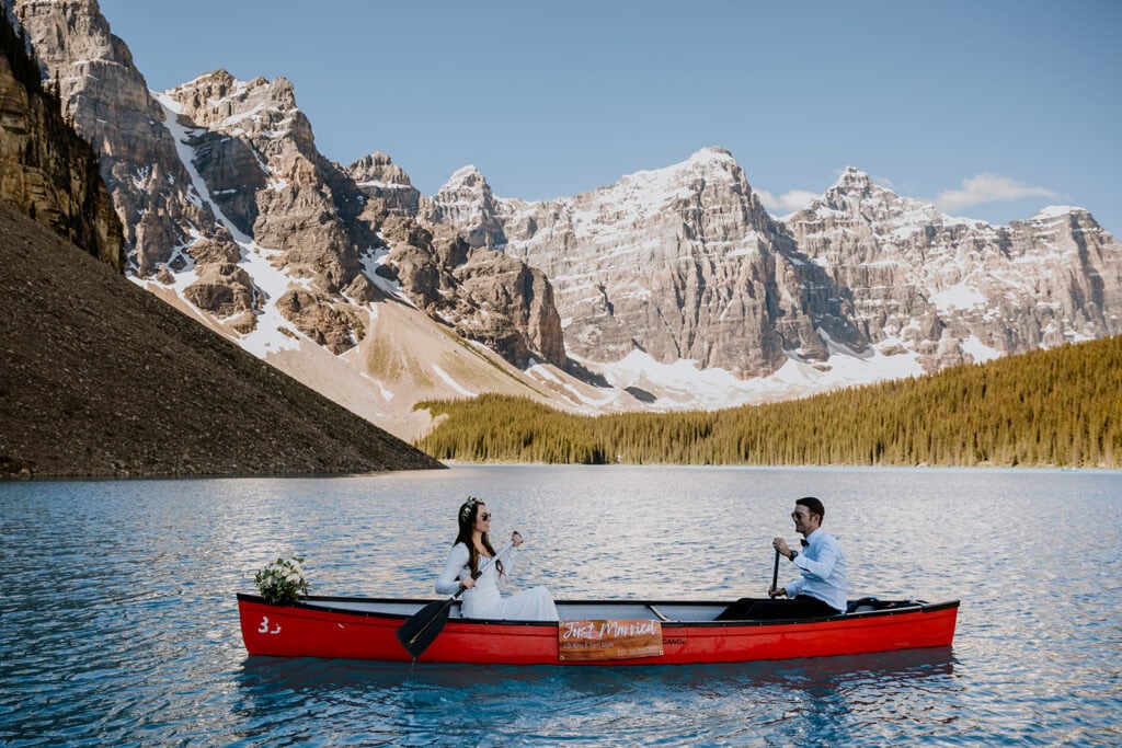 Couple just married going for a ride in a canoe 
