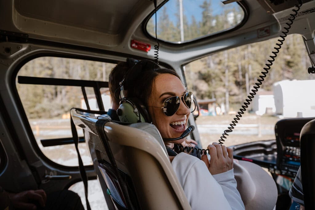 how to plan a Banff helicopter wedding/elopement - bride in the helicopter