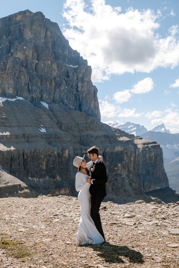 Couple sharing a dance with stunning mountain views in the background