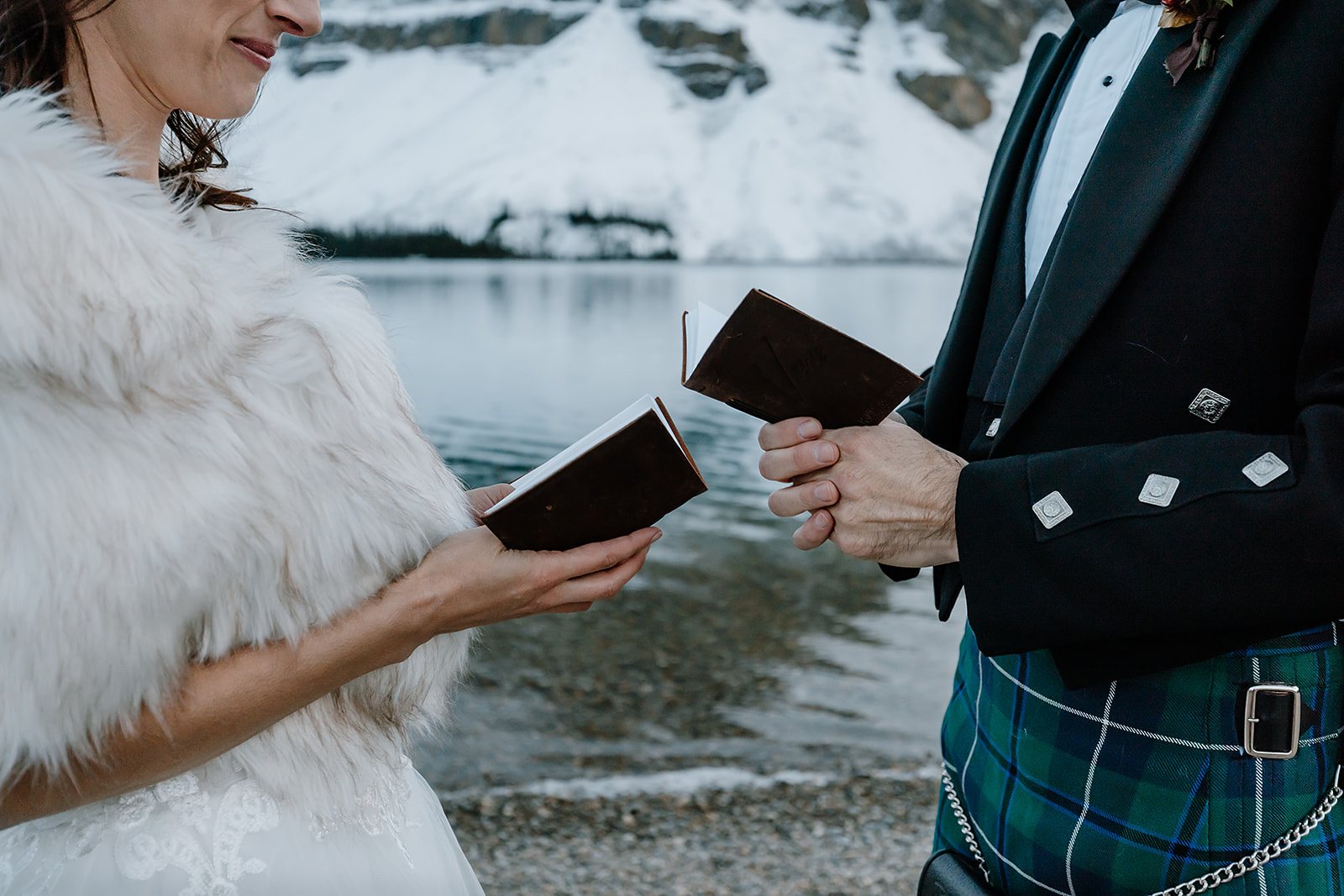 a couple exchanges vows during their Bow Lake Wedding